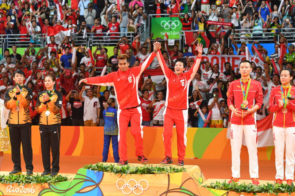 Aug 17, 2016; Rio de Janeiro, Brazil; (L-R) Nan Zhang and Yunlei Zhao (CHN), Tontowi Ahmad and Liliyana Natsir (INA), and Peng Soon Chan and Liu Ying Goh (MAS) celebrate after winning medal during the mixed doubles in the Rio 2016 Summer Olympic Games at Riocentro - Pavilion 4. Mandatory Credit: Christopher Hanewinckel-USA TODAY Sports